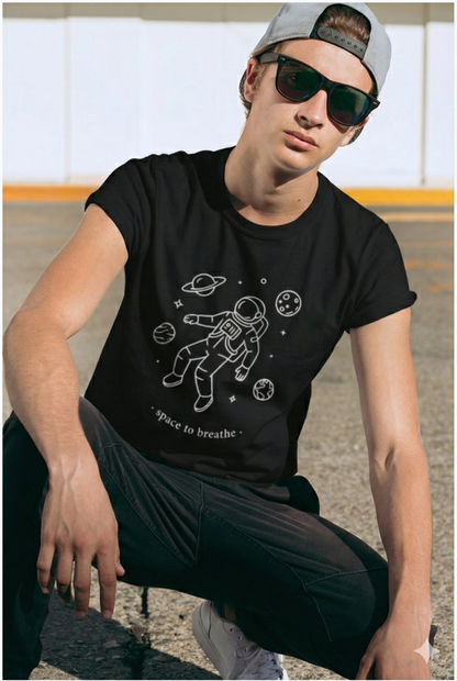 Person wearing a black t-shirt with an astronaut graphic and 'space to breathe' text.